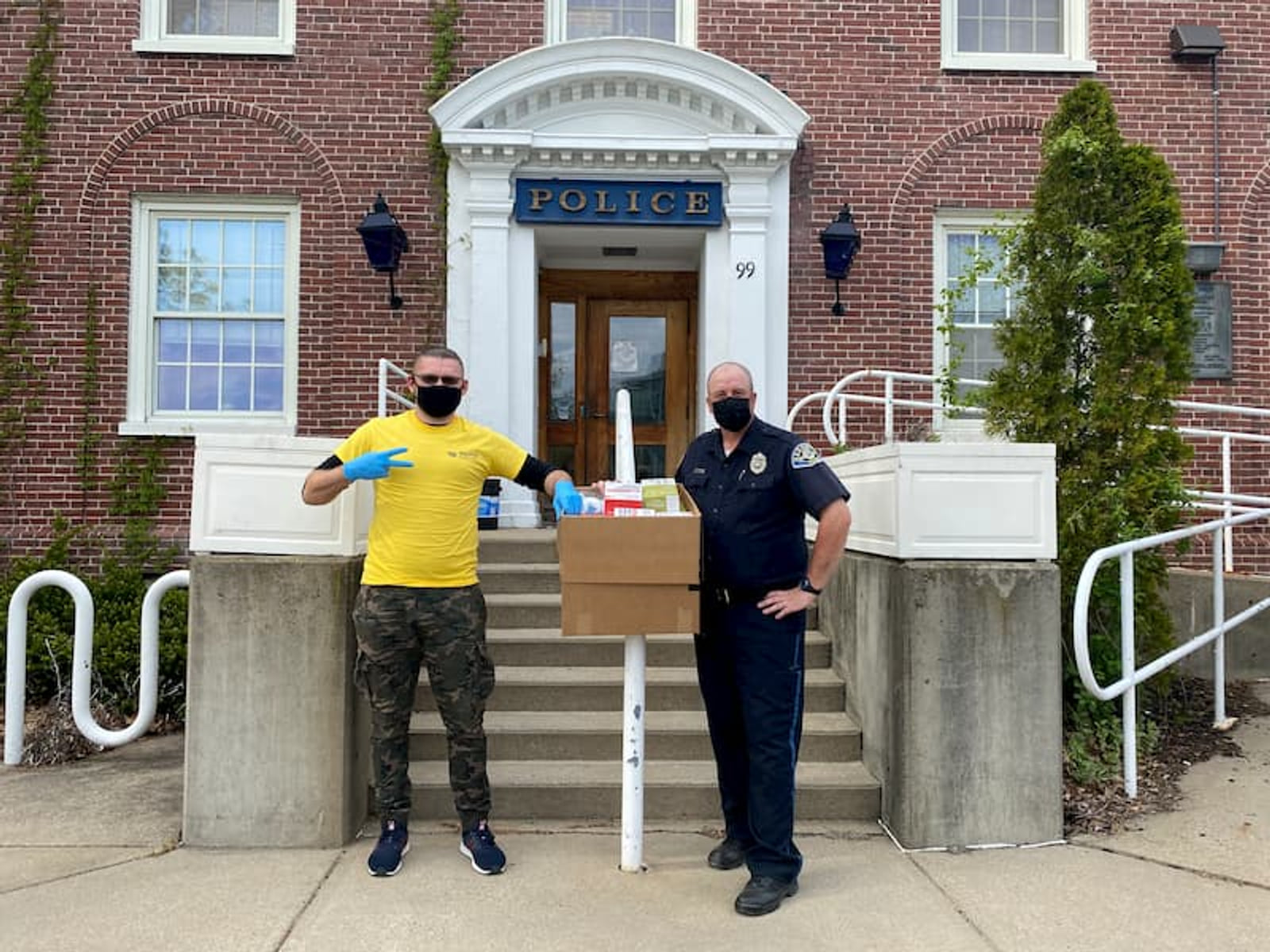 Archived Milvus PPE donation photograph with a local police officer
